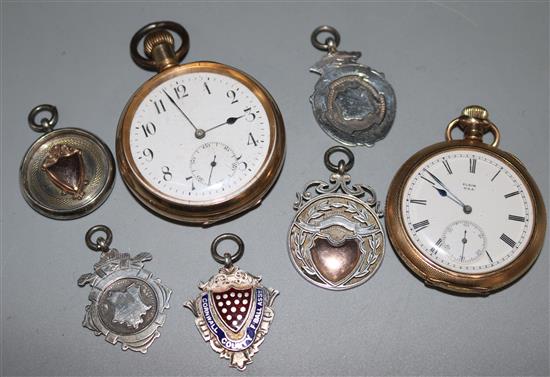 Two gold plated pocket watches and five silver fobs.